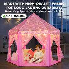 A toddler sitting inside a high-quality, durable pink play tent with reinforced stitching and non-toxic polyester fabric.
