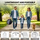 A woman carrying the lightweight folded trapezoidal playpen while walking her dog, featuring a 4-step 'W' folding design diagram for easy setup.