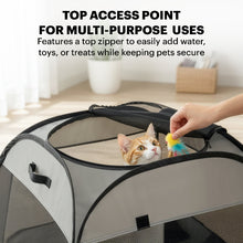 A cat sitting inside the grey trapezoidal pet playpen with the top mesh zippered cover fully opened for easy access.